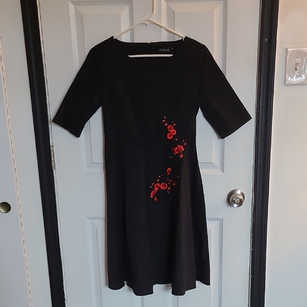 Elegant Black Dress with Red Floral Accents